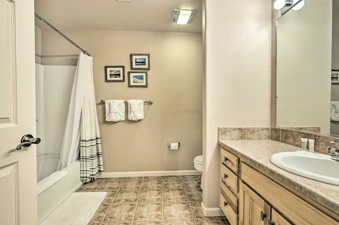 Downstairs bathroom with tub and shower in the Fraser condo